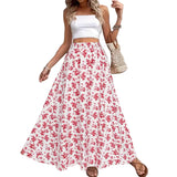 Woman wearing a white top and red floral skirt with a neutral background