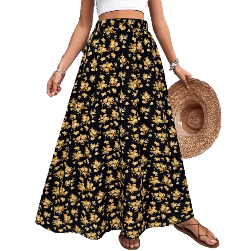 Woman wearing a black floral skirt with a straw hat on a white background