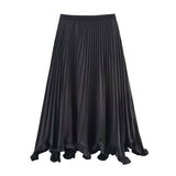 Black pleated skirt on a white background
