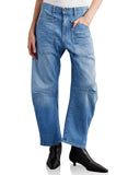 Blue jeans worn by a person on a white background