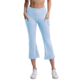 Light blue capri pants worn by a person on a white background