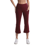 Maroon capri pants worn by a person on a white background