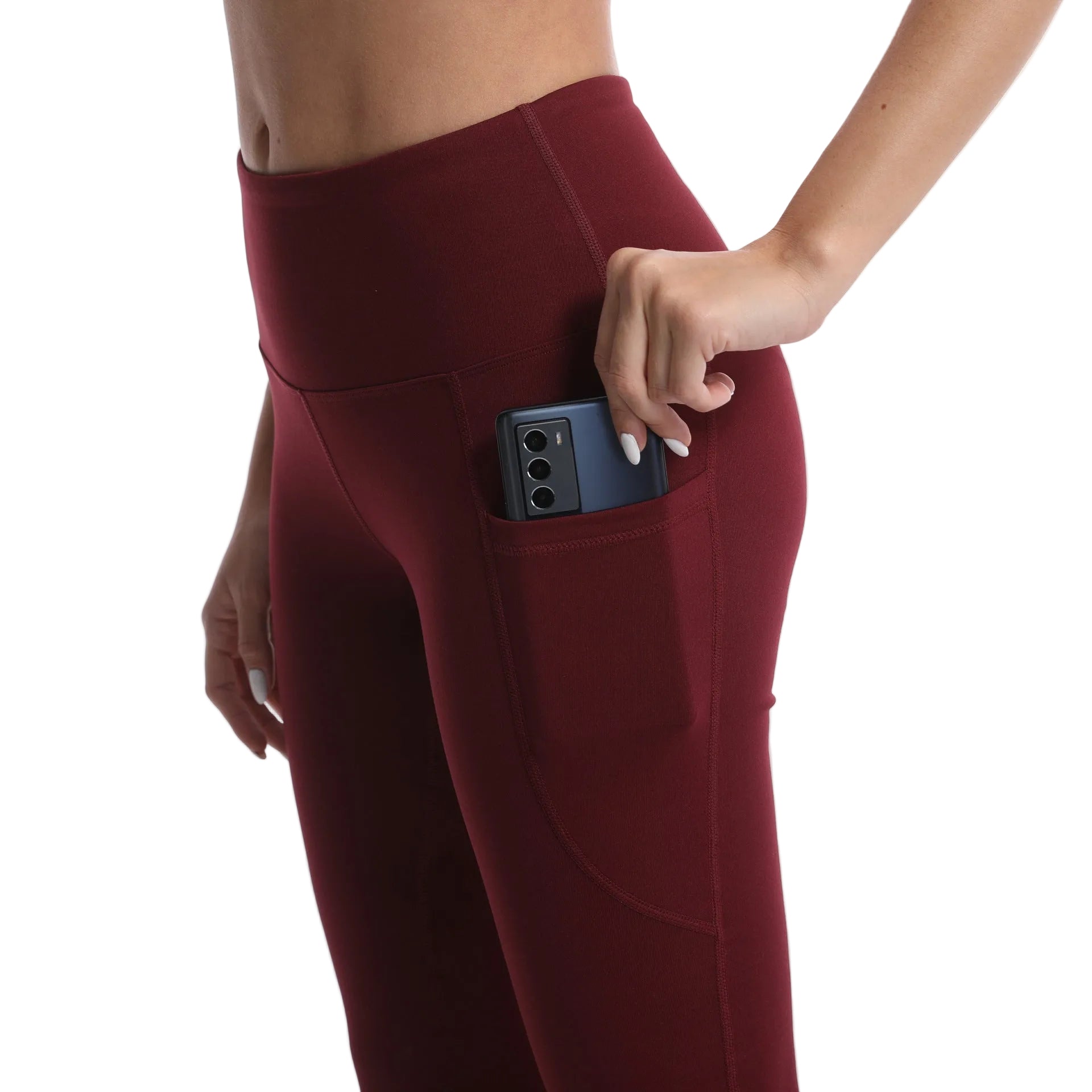 Maroon leggings with a pocket holding a phone on a white background