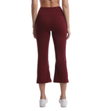 Maroon pants worn by a person on a white background