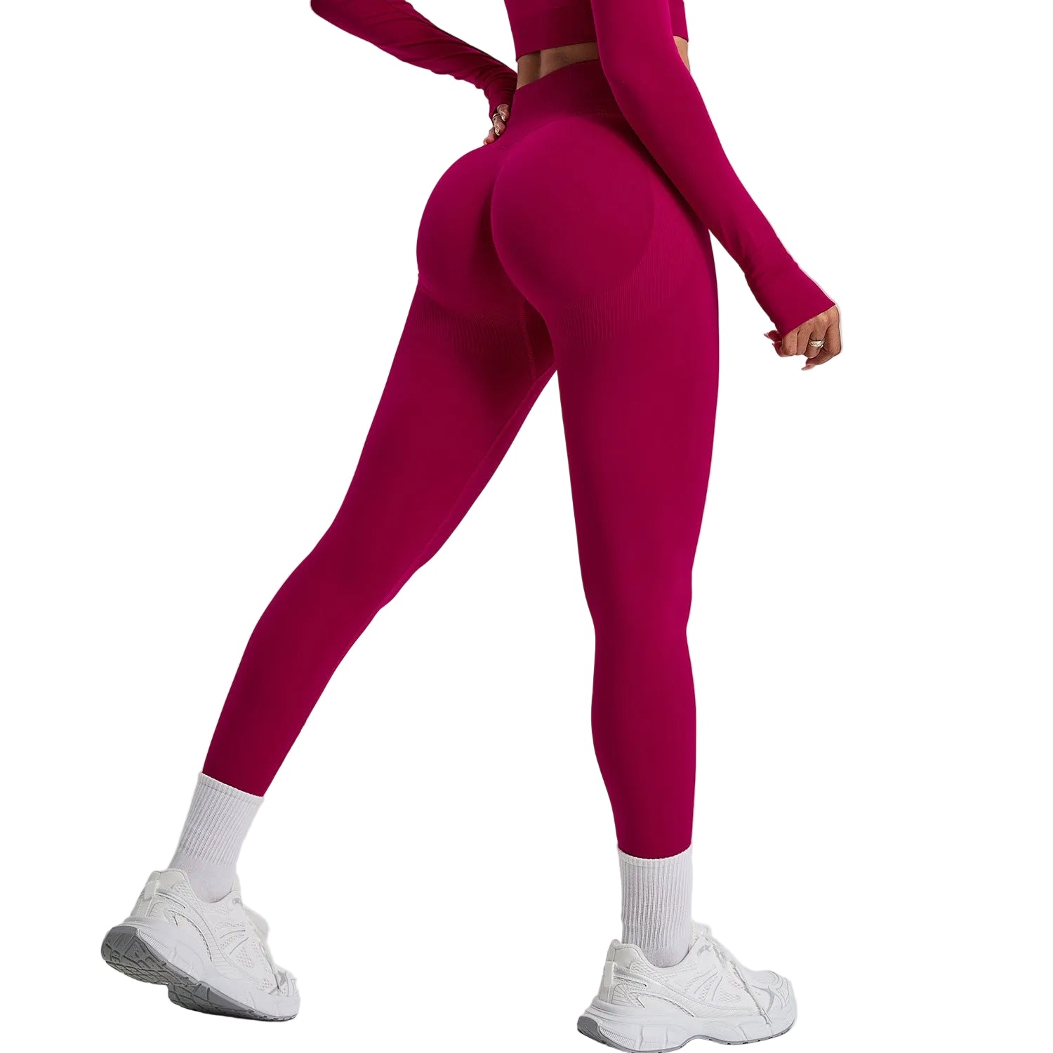 Person wearing a pink athletic outfit on a light gray background