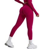 Person wearing a pink athletic outfit on a light gray background