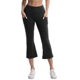 Person wearing black capri pants on a white background