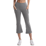 Person wearing gray capri pants on a white background