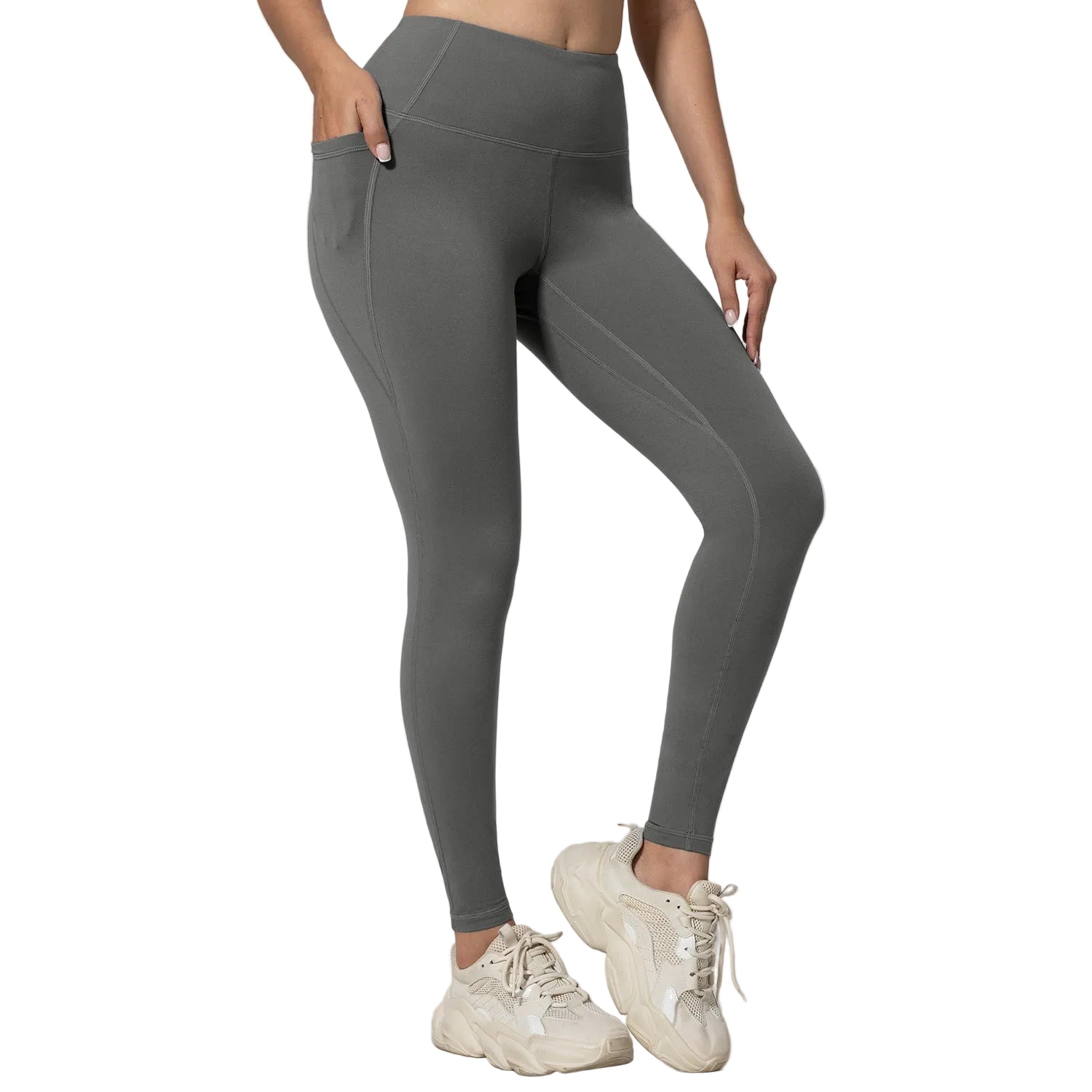 Person wearing gray leggings and white sneakers on a light gray background