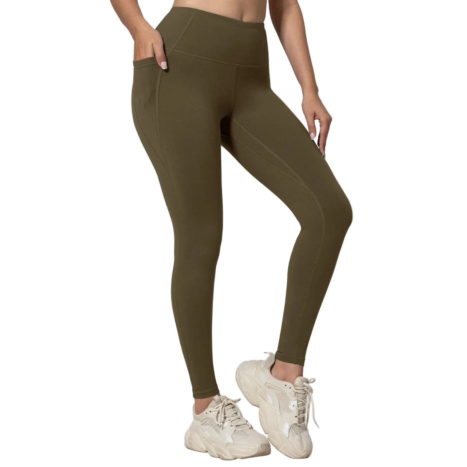 Person wearing olive green leggings and white sneakers on a light gray background