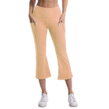 Person wearing peach-colored pants on a white background