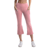 Person wearing pink capri pants on a white background