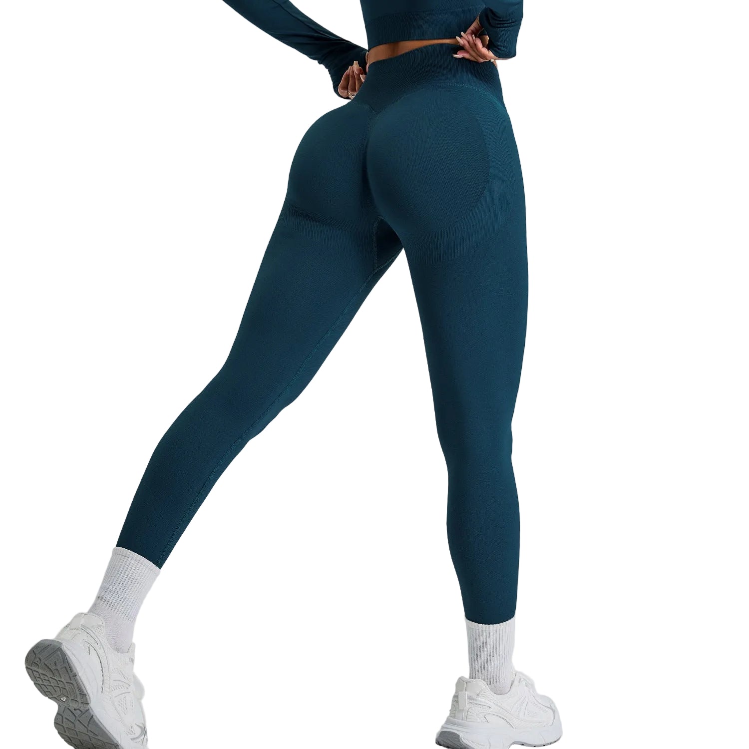 Person wearing teal leggings and white sneakers on a light gray background