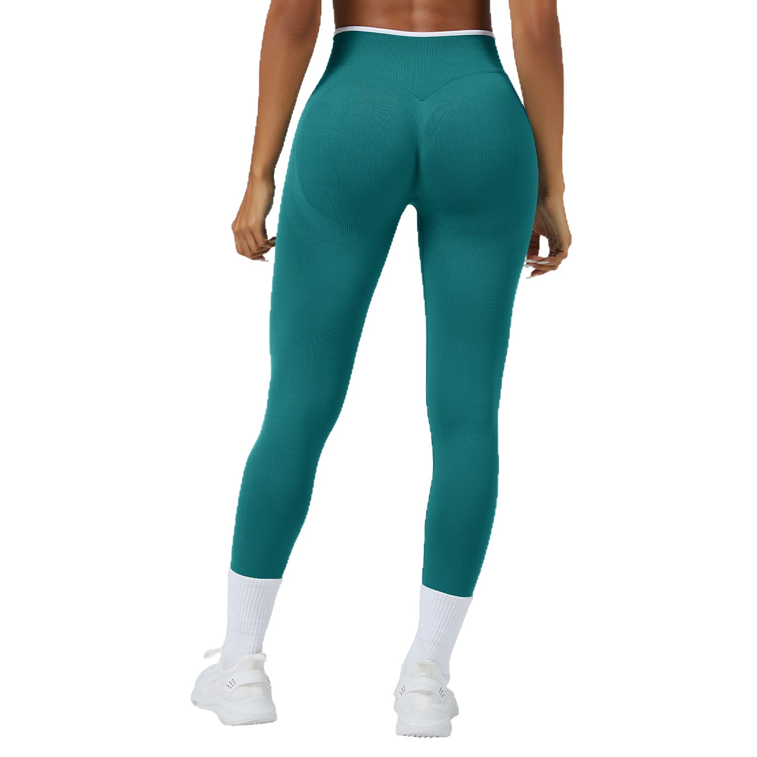 Teal leggings worn by a person on a white background
