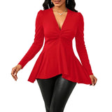 Red long-sleeve top worn by a model against a white background