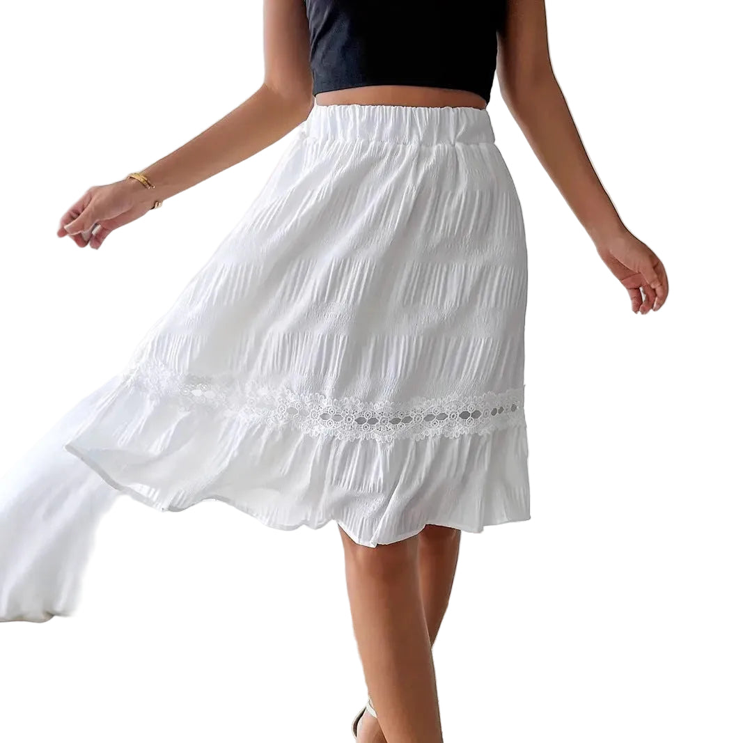 White skirt with lace details worn by a person indoors.
