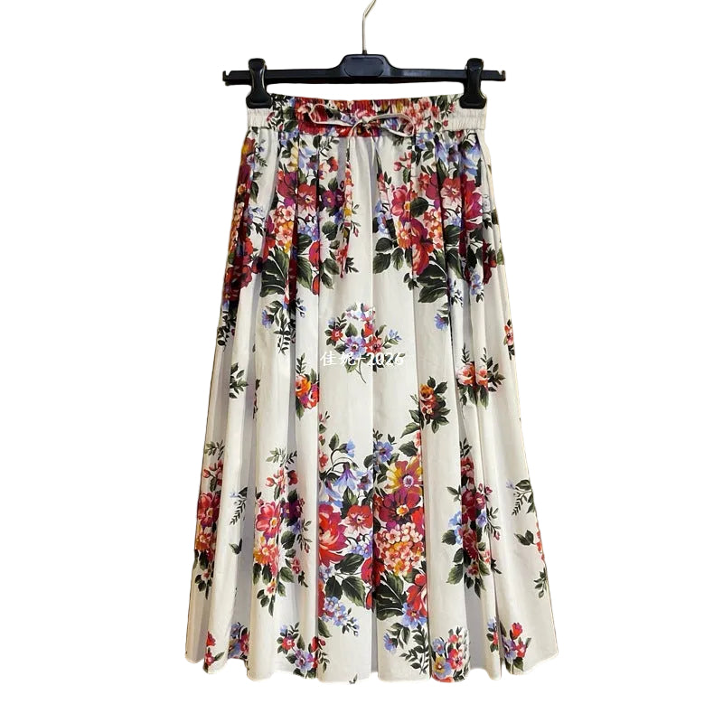 Floral skirt on a hanger against a gold background