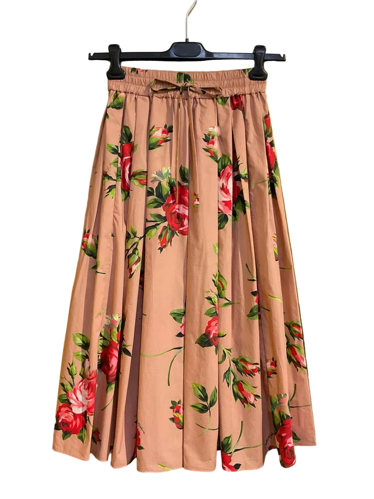 Floral skirt on a hanger against a yellow background