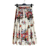 Floral skirt on a hanger against a gold background