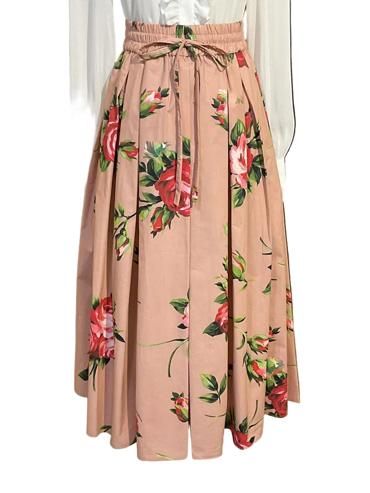 Floral patterned skirt on a mannequin against a gold background
