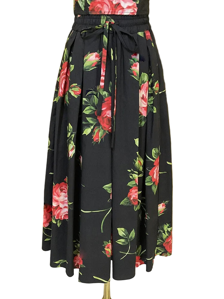 Black floral skirt with pink roses on a gold background