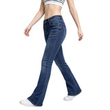 Person wearing blue flared jeans on a white background