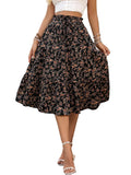 Person wearing a floral skirt on a stone pavement with a building in the background