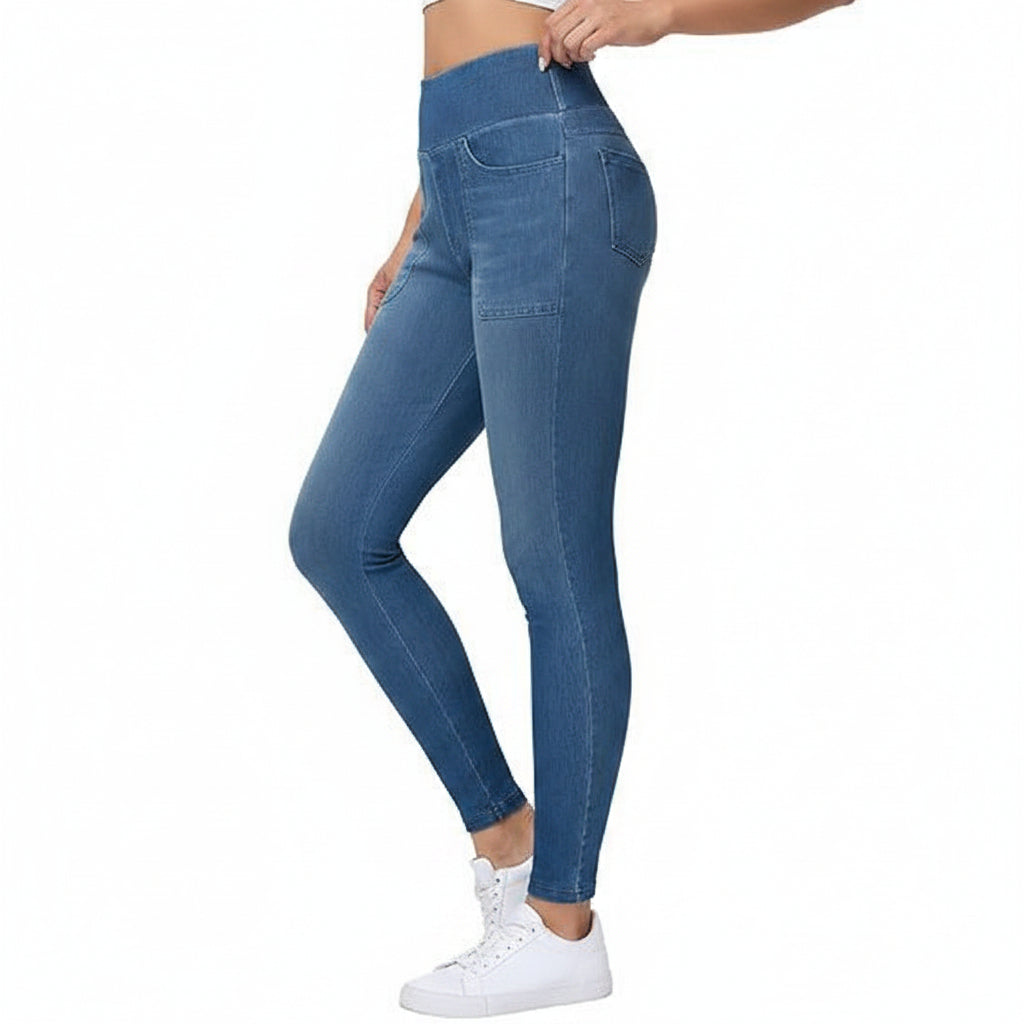 Blue jeans worn by a person on a white background