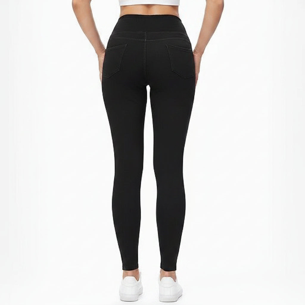 Person wearing black leggings on a white background