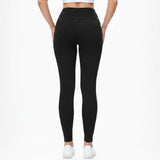 Person wearing black leggings on a white background