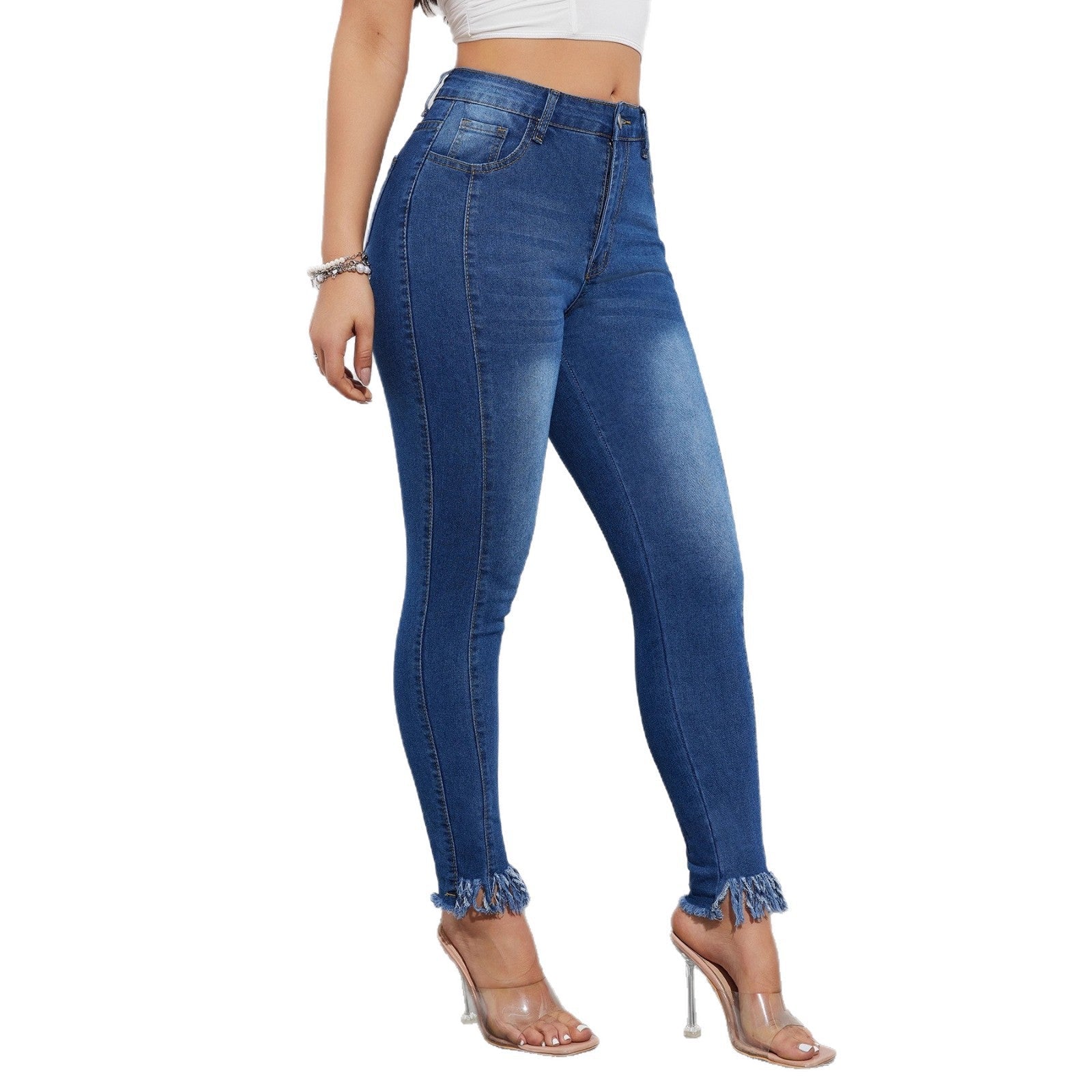 Blue jeans worn by a person on a white background