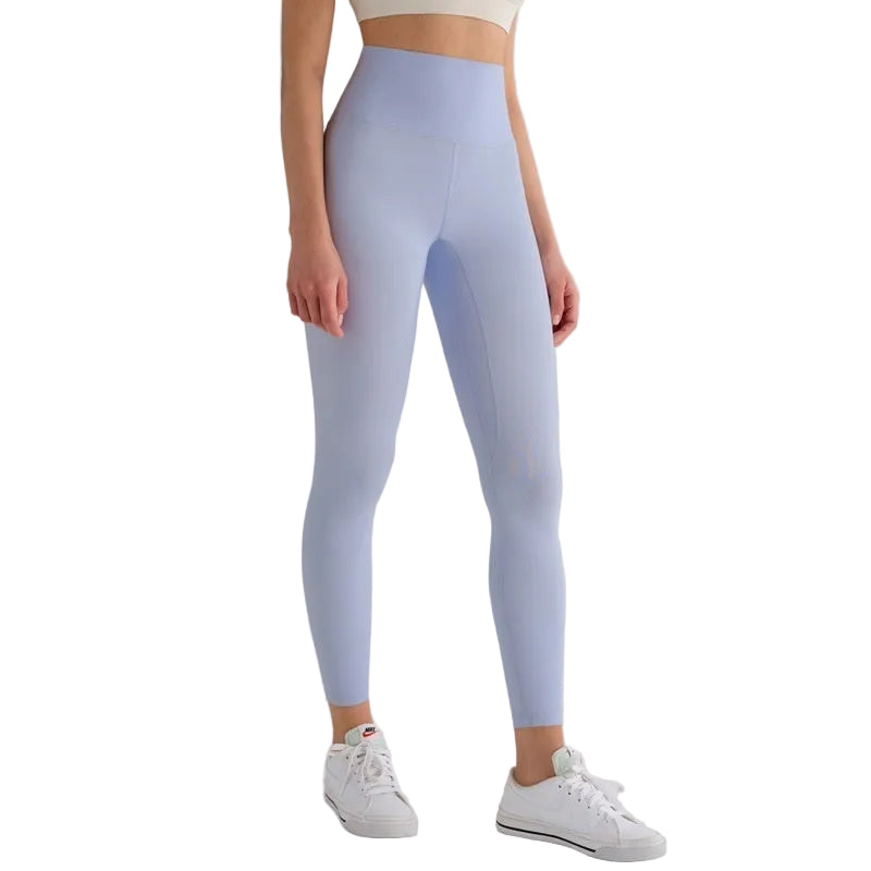 Light blue leggings worn by a person on a white background with 'T-line sports edition' label.