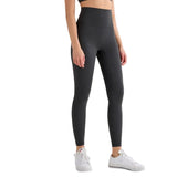 Person wearing black leggings with a white background and 'T-Line Sports Edition' label.