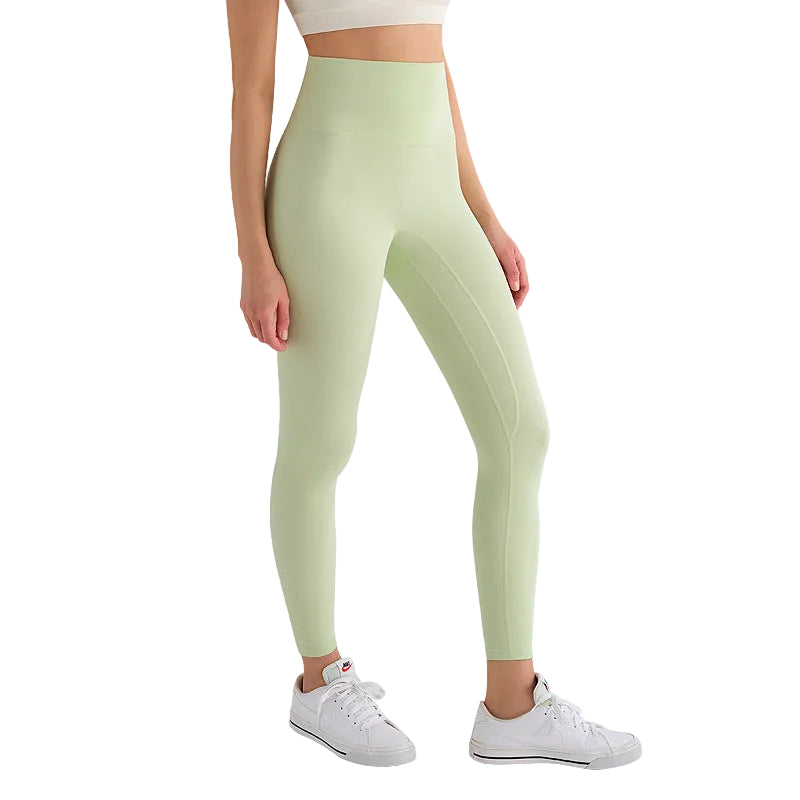Light green leggings worn by a person on a white background