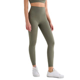 Person wearing olive green leggings with a white background and 'T-Line Sports Edition' label.