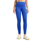 Person wearing blue leggings on a gray background