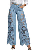 Light blue jeans with lace detailing on a plain background