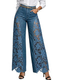Blue jeans with lace detailing on a white background