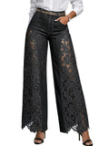 Black lace pants worn by a person on a light gray background