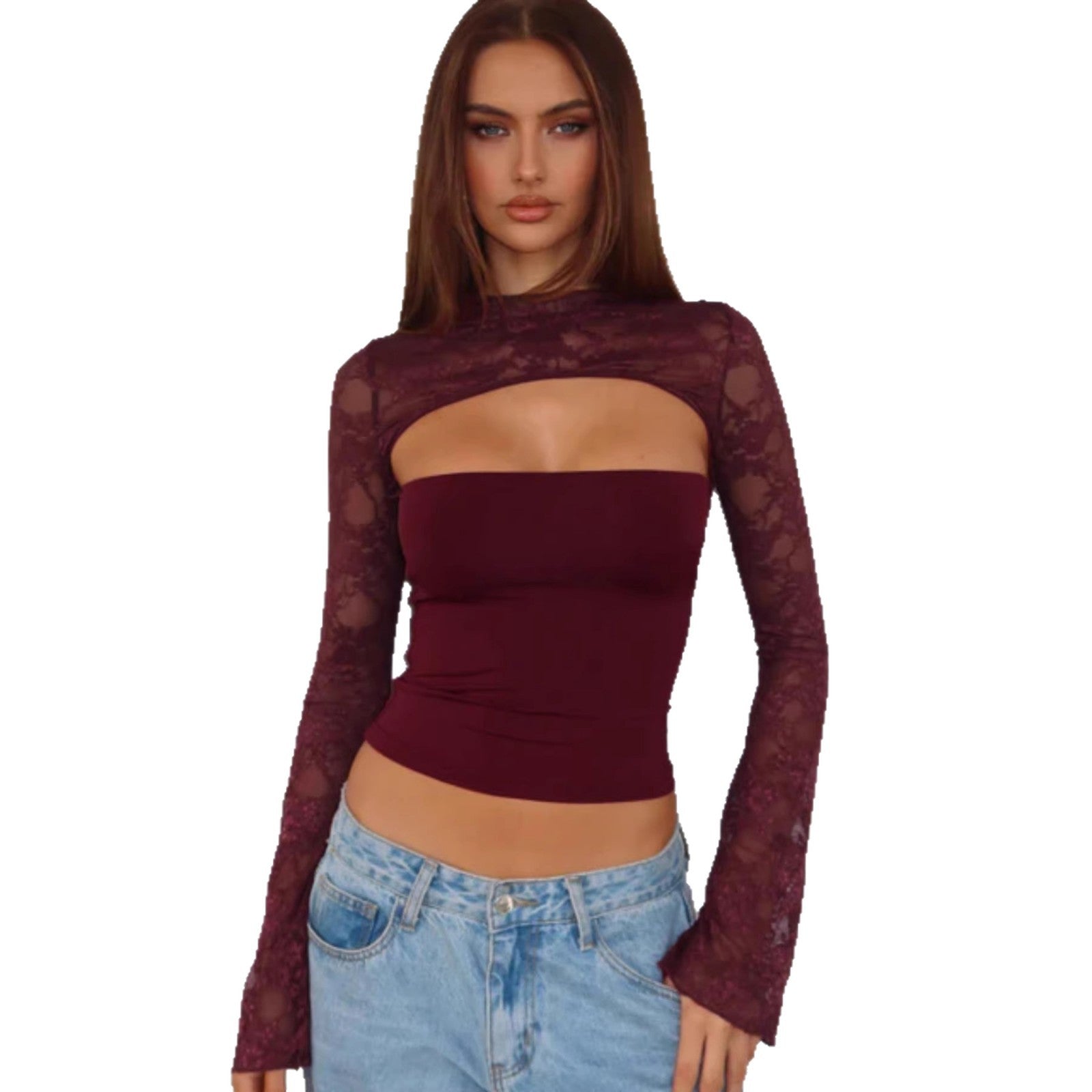 Woman wearing a burgundy lace top and blue jeans on a white background
