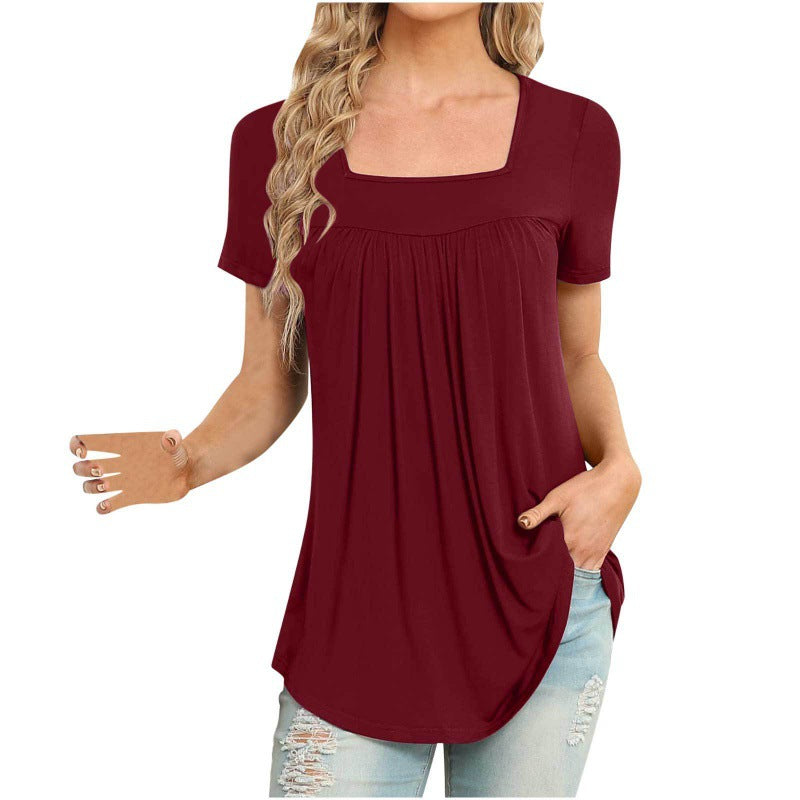 Woman wearing a burgundy t-shirt with a plain background
