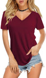 Woman wearing a burgundy V-neck t-shirt and denim shorts on a white background