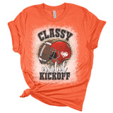 Orange t-shirt with football graphic and text on a white background