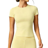 Person wearing a light yellow athletic outfit on a white background